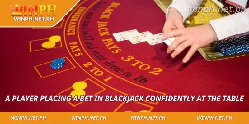 A player placing a bet in blackjack confidently at the table